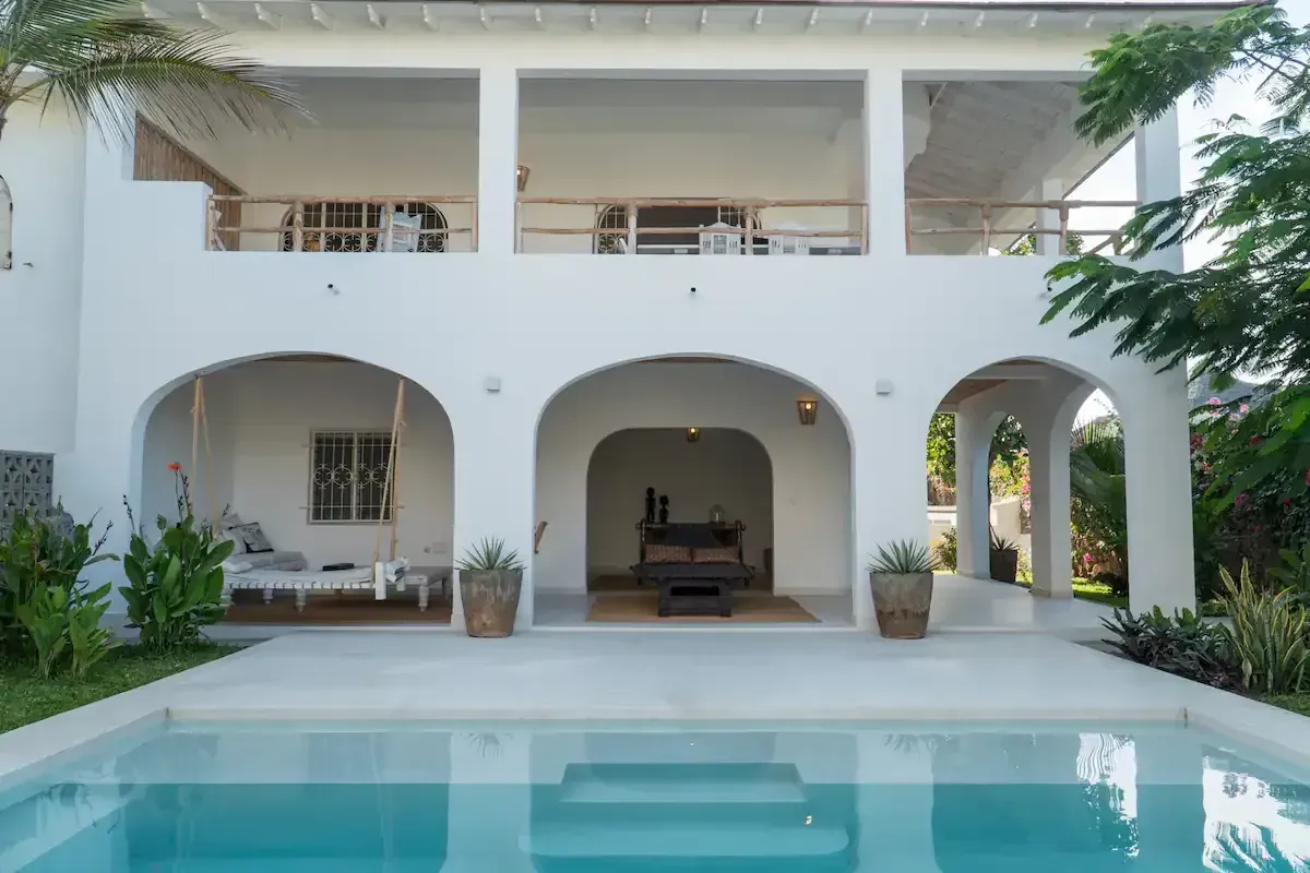 A white Swahili style villa with a swimming pool on the Kenyan coast