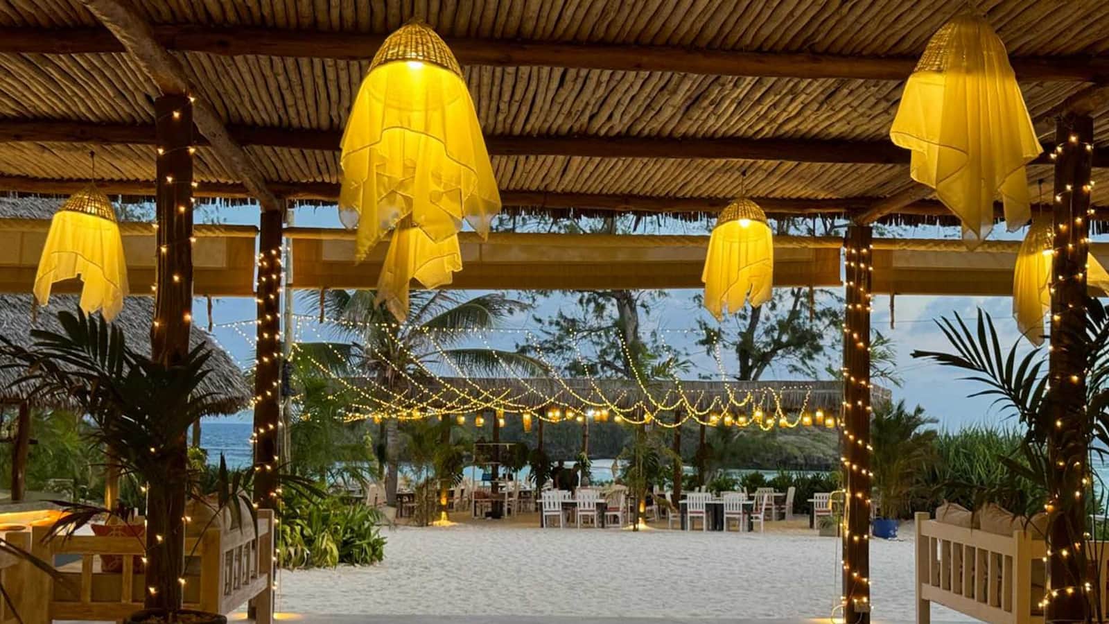 A beach venue in Watamu set up with lanterns and fairy lights for an evening event