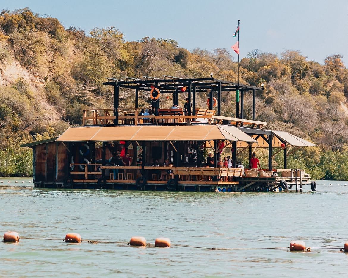 Restaurant table with coastal food and ocean view in Kilifi, Kenya
